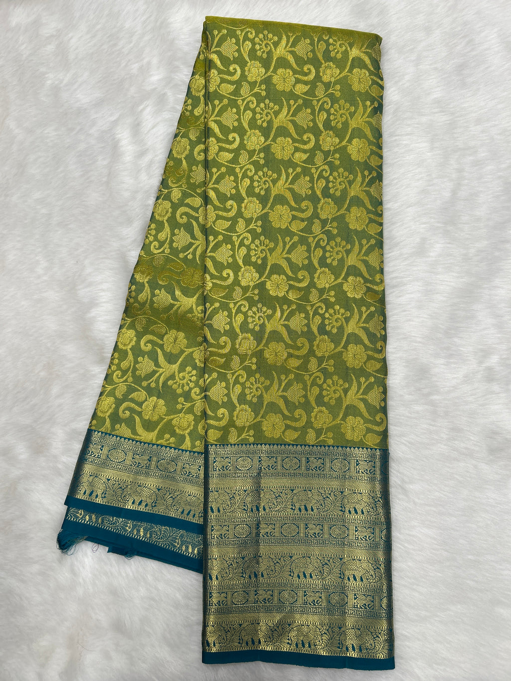 Olive green Brocade Kanjeevaram Silk Saree with a rich Teal border