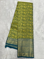 Olive green Brocade Kanjeevaram Silk Saree with a rich Teal border