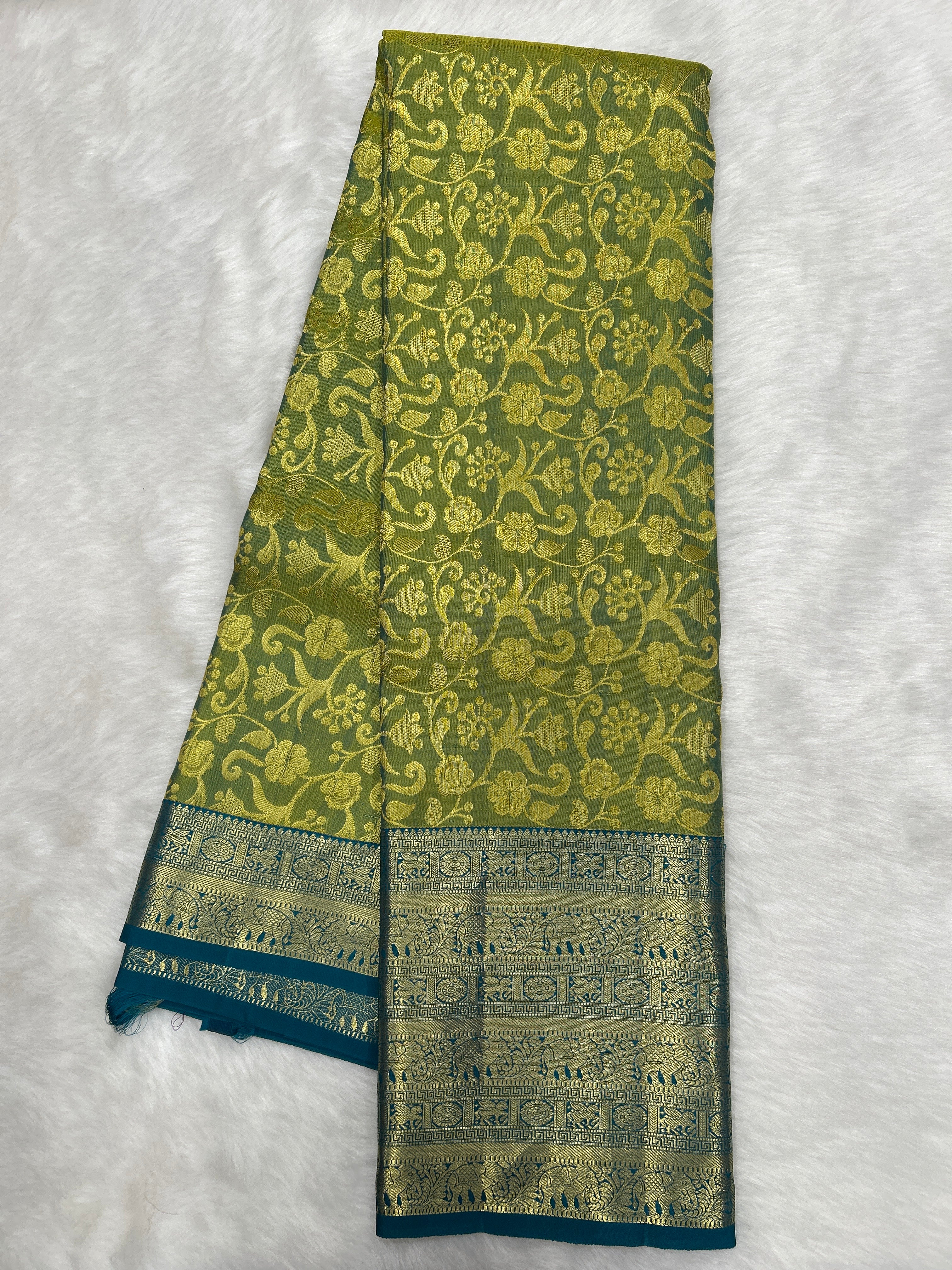 Olive green Brocade Kanjeevaram Silk Saree with a rich Teal border