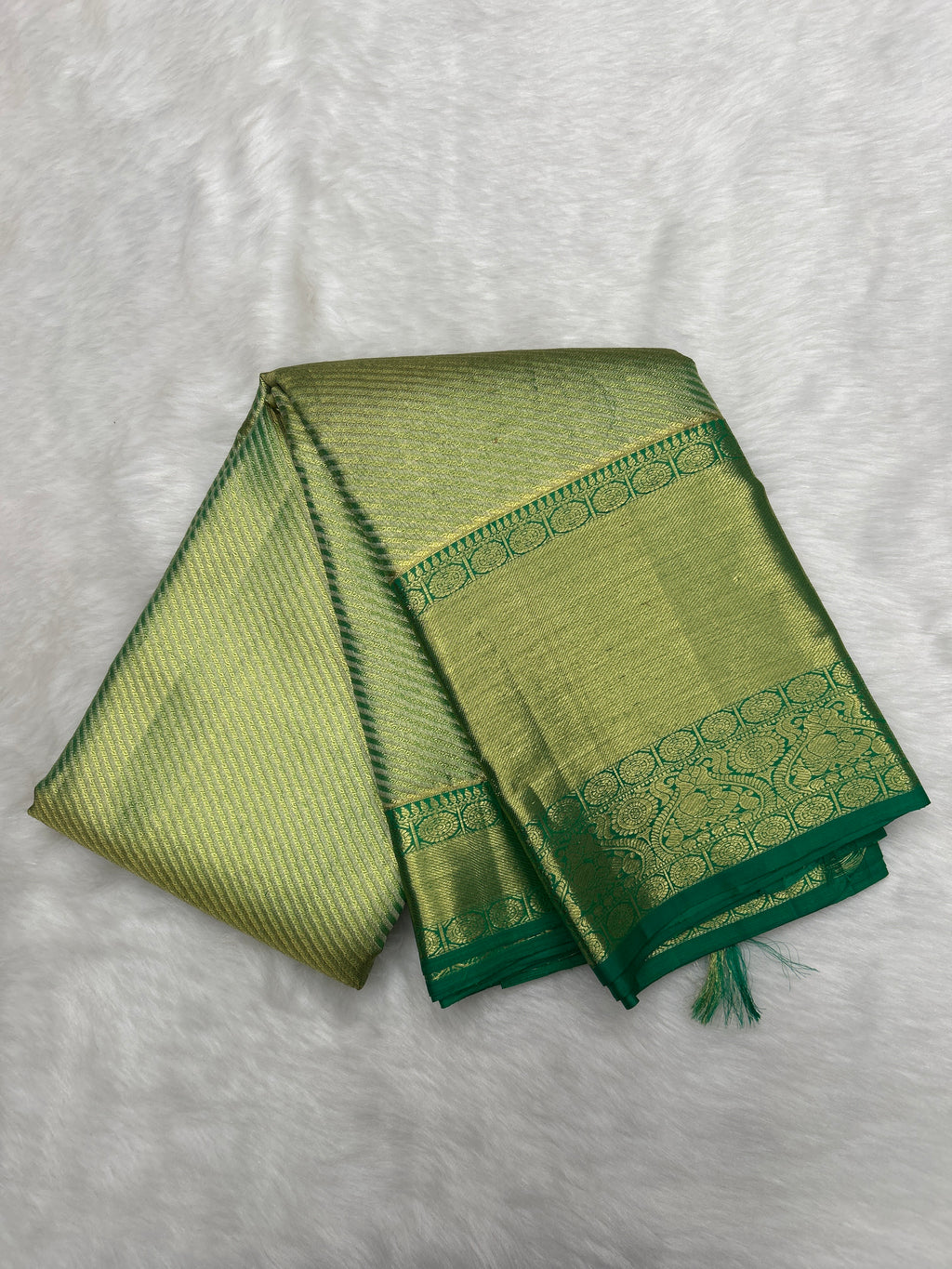 Green Kanjeevaram Tissue Saree with cross-sectional zari lines
