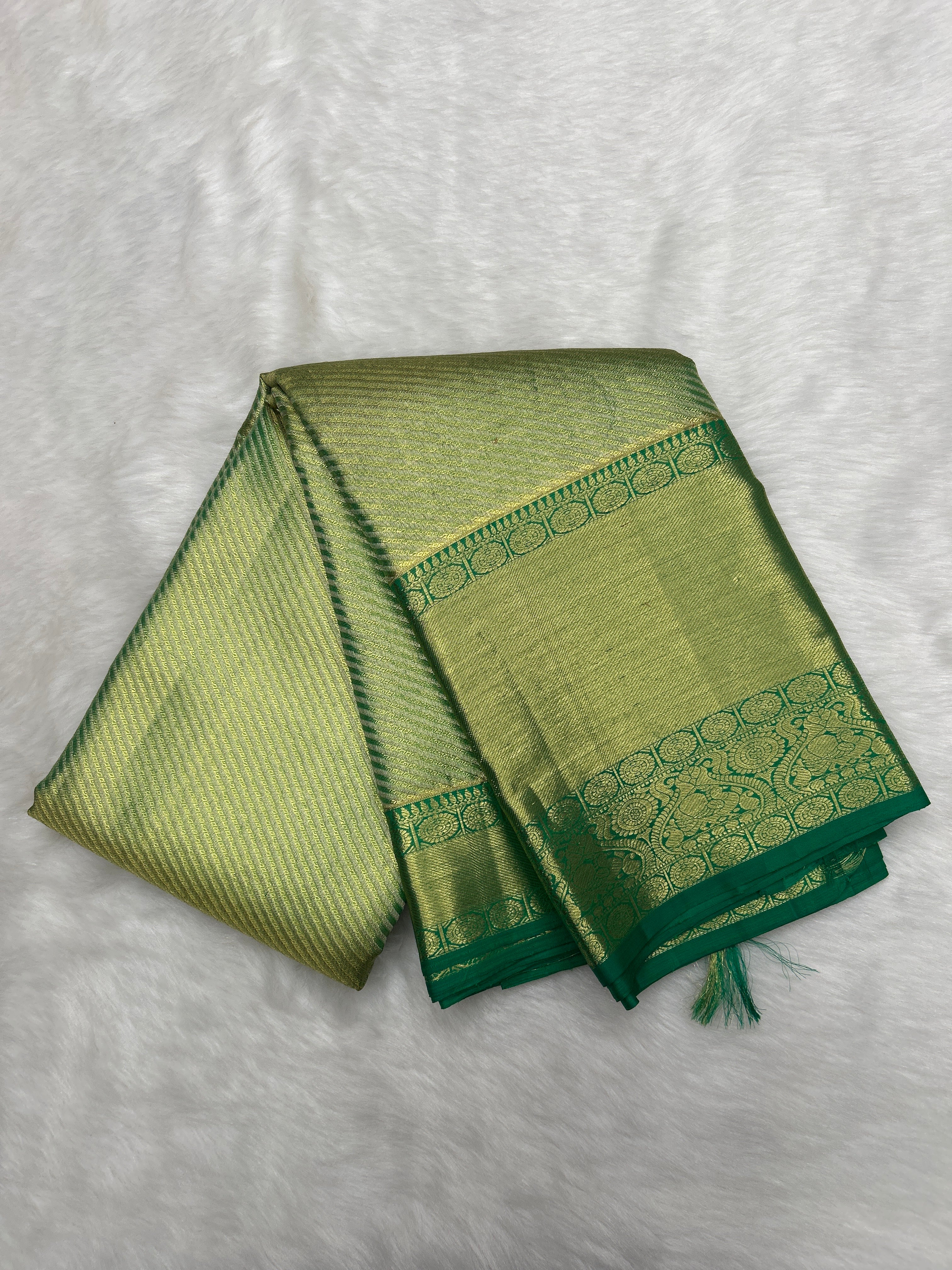 Green Kanjeevaram Tissue Saree with cross-sectional zari lines
