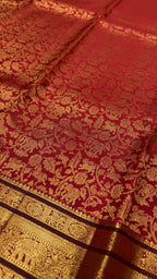 Bright Rust Kanjeevaram silk Saree with Vanam Singaram and (Varisapet / Meena) Border
