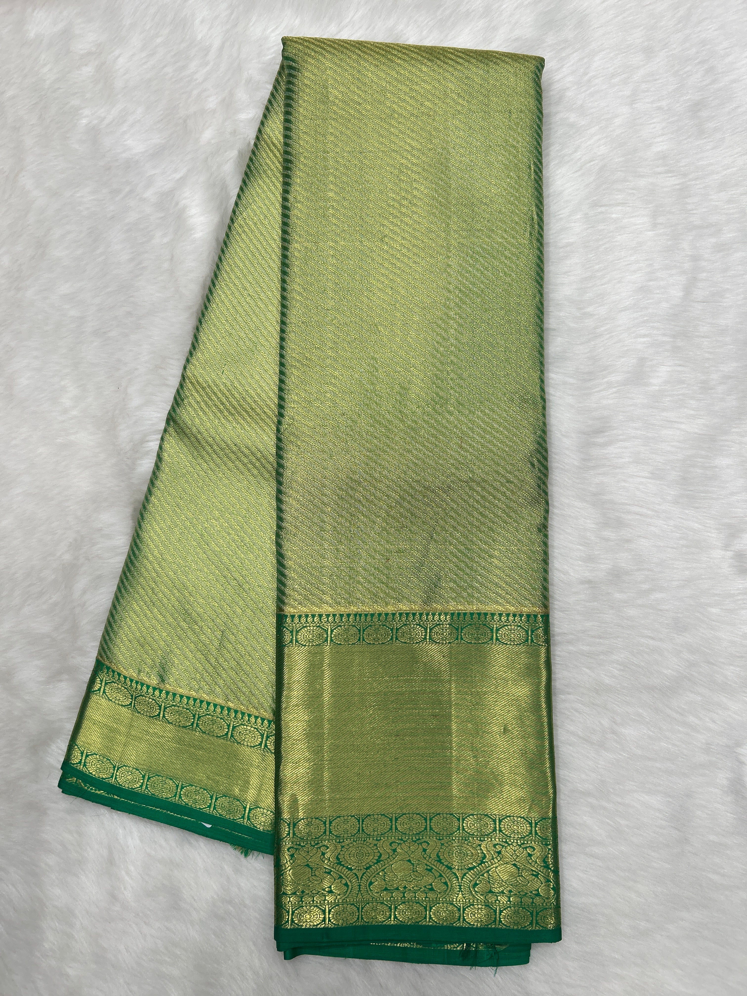 Green Kanjeevaram Tissue Saree with cross-sectional zari lines